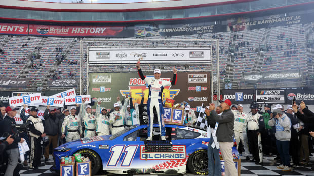 Denny Hamlin celebrates in victory lane after winning the NASCAR Cup Series Food City 500 at Bristol Motor Speedway on Sunday. (Photo by Meg Oliphant/Getty Images)